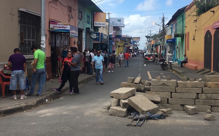 Street in Nicaragua with construction and people walking