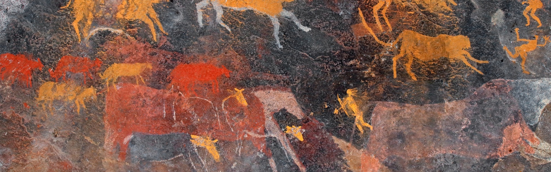 Cave drawings of horses in red and yellow