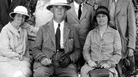 a group of seven white looking archaeologists posing